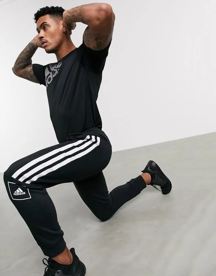 adidas skinny 3 stripe joggers in black